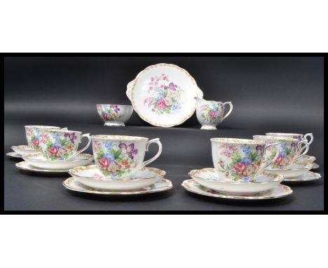 A Royal Albert Nosegay pattern tea service, comprising: six cup saucer and side plate trios, open sugar bowl, milk jug and sa