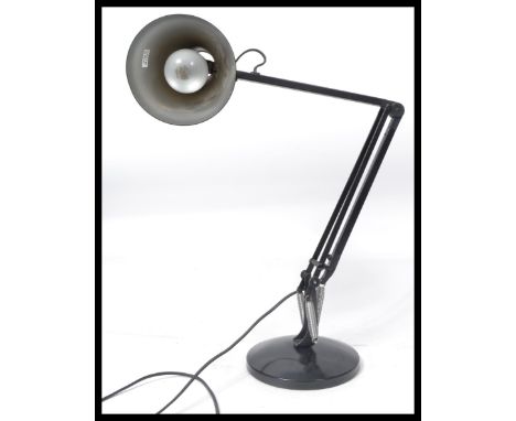 A 20th century vintage Anglepoise desk lamp in the manner of Herbert Terry. Black colourway with terraced base and pendant sh