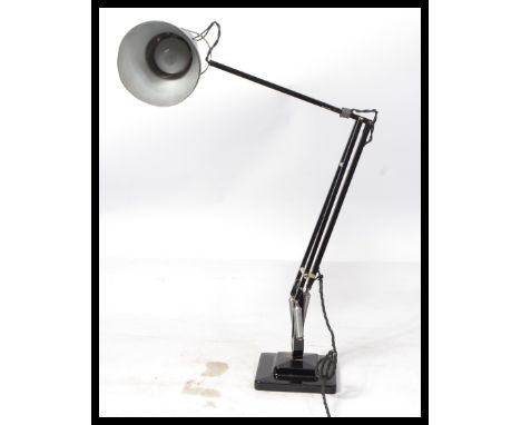 A 1940's Industrial pre-war Herbert Terry anglepoise lamp, raised on a cast metal two step base with pendant shade, finished 