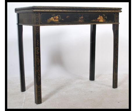 A 19th Century ebonised and chinoserie anglo Chinese colonial inspiored games / card table. The rectangular top decorated in 