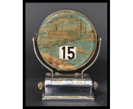 A vintage early 20th century tin perpetual flip desktop calendar with views of London depicting Houses of Parliament Westmins
