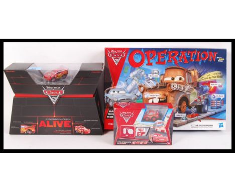 Three Disney Pixar ' Cars ' related items to include; Mattel Lightning McQueen Alive figure, Cars 2 Operation board game &amp