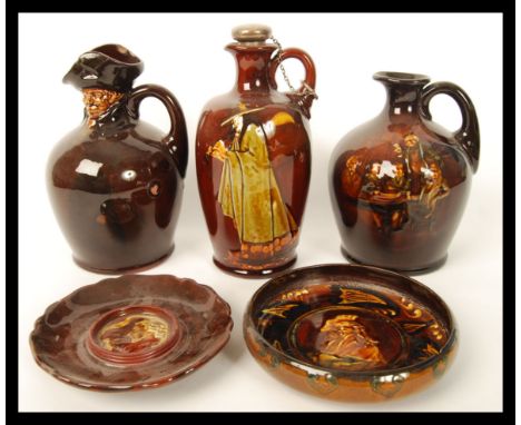 A good collection of Royal Doulton kingsware liqueur flasks to include the pied piper liquer flask having a hallmarked silver