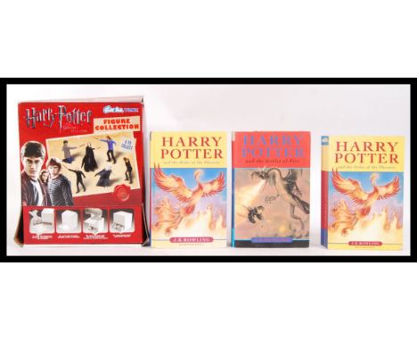 An assorted collection of Harry Potter related items to include; hardback first edition of Harry Potter &amp; the Order of th