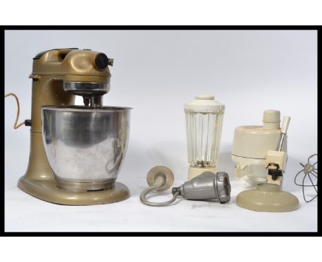 A vintage mid century Kenwood Major kitchen mixer complete with accessories. The vintage mixer of space age form in the origi