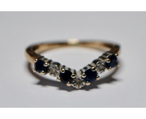 A hallmarked 9ct gold sapphire and diamond wishbone ring having alternating illusion set diamonds and blue sapphire stones. S