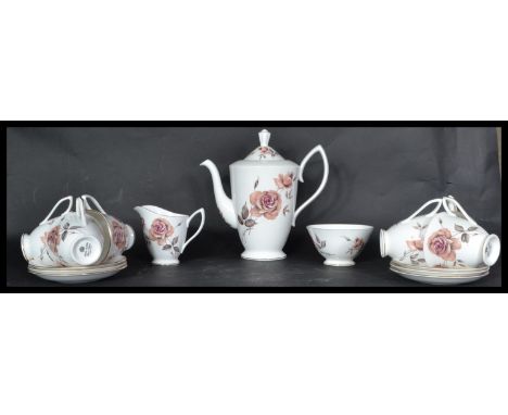 A Royal Albert Bone China coffee service, the service consisting of Coffee pot, cups, saucers, creamer, sugar bowl etc please