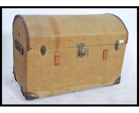 A 19th century Victorian green canvas bound wooden steamer trunk chest with dome top, tray to inner. The trunk with leather h