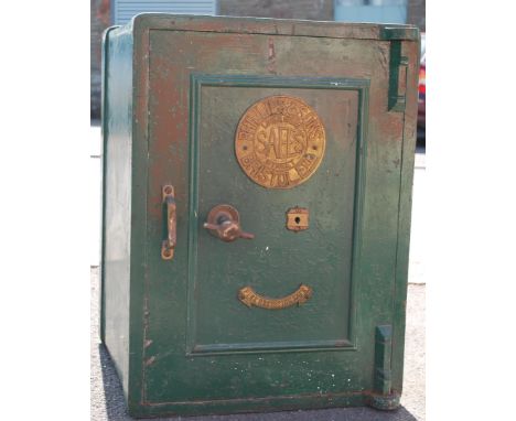A vintage early 20th Century fire resistant green painted stainless steel safe, brass mechanism with plaque to the front Unio