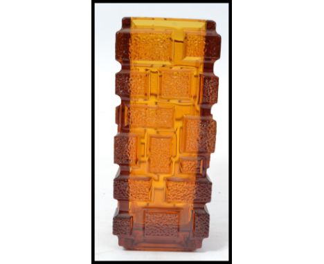 A vintage Whitefriars style orange glass brick vase having a textured brick design. In the manner of a Geoffrey Baxter Drunke