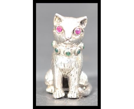 A sterling silver pin cushion pincushion in the form of a cat having inset ruby eyes in the manner of Adie and Lovekin. Weigh
