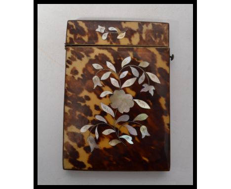 A 19th century Victorian tortoiseshell card case of rectangular form, side hinged button release lid, blonde shell to spine, 