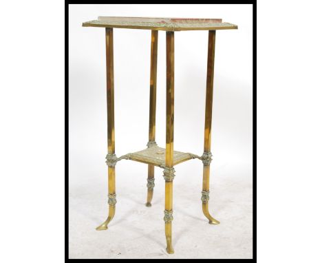 A vintage 20th century Antique style marble topped planter stand of gilt brass construction. Raised on splayed legs with squa