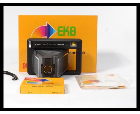 A vintage retro 20th century Kodak EK8 Polaroid type instant camera complete in original box with unused box of Kodak colour 
