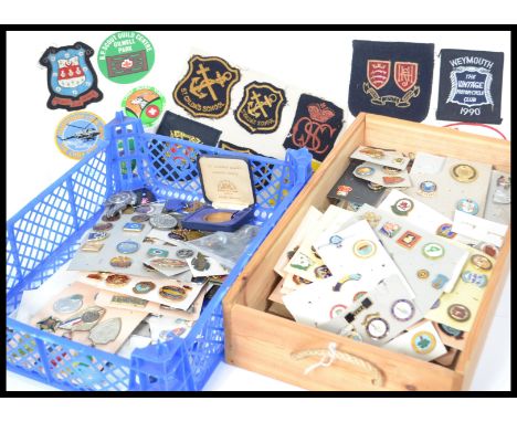 A large collection of vintage enamel badges to include various bowling badges , sports , medals , along with cloth patches et