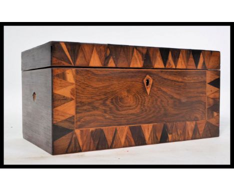 A 19th century Georgian rosewood tea caddy box having specimen inlaid borders. Hinged lid opening to reveal twin lift out cad