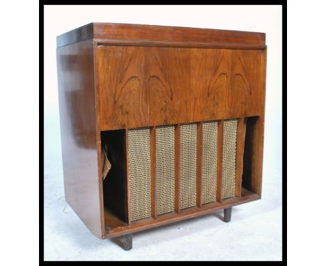 A vintage mid 20th century walnut cased Marconi Marconiphone radiogram, hinged top with speaker to the front with the origina