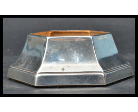 A sterling silver hallmarked inkwell base by Carrs of Sheffield. The inkwell of hexagonal form. Measures 4 cm high, 8 cm wide