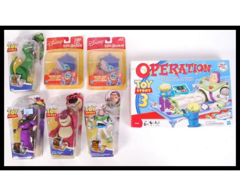 An assorted collection of Disney &amp; Pixar related items to include; 2x Hasbro Lilo &amp; Stitch Skitterin' Stitch figures,
