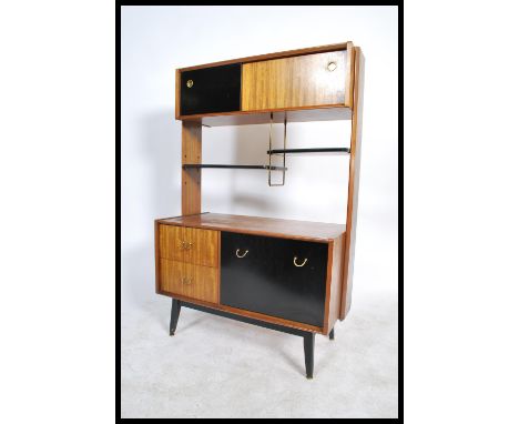 E Gomme for G-Plan, a 1950's mid century room divider, with shelf and cupboard arrangement above a cupboard and drawer base i