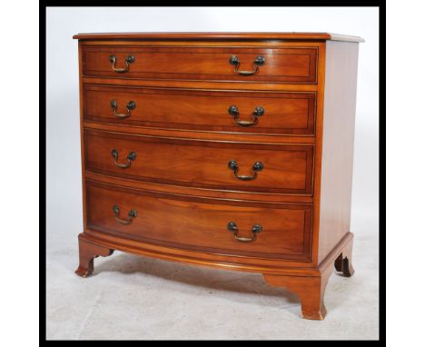 A contemporary Regency revival bow fronted mahogany chest of drawers, fitted with four stencil lined graduating drawers with 