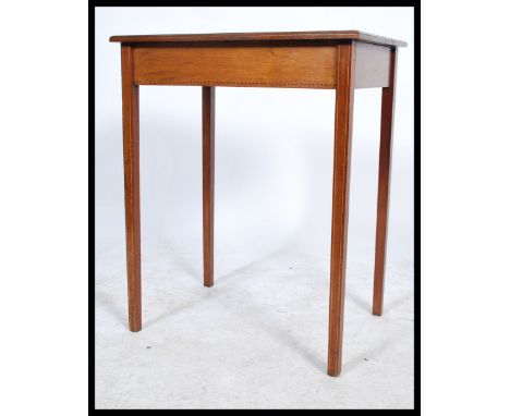 An early 20th century Edwardian&nbsp; mahogany inlaid occasional / side / lamp&nbsp; table raised on tapering square legs wit