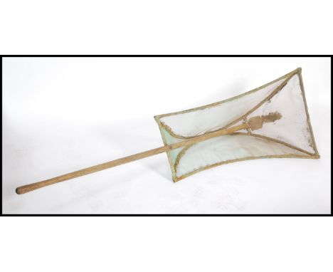 A vintage 20th century Elvers ( young eels ) net, the unusual shaped net supported by the long pole with notation reading SWA