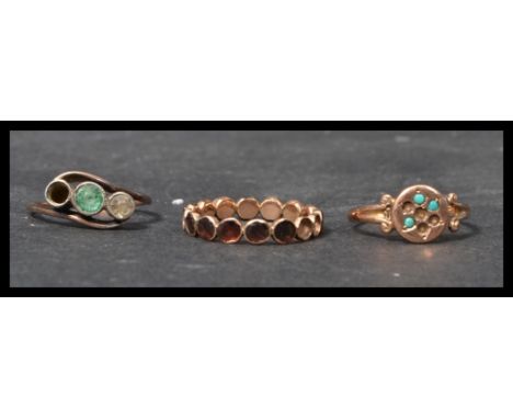 A group of three 9ct gold antique rings to include a three stone crossover ring with green and white stone , a gold and turqu