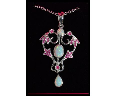 A sterling silver pendant necklace set with ruby and opal of scrolled foliage form&nbsp;complete in jewellery presentation bo