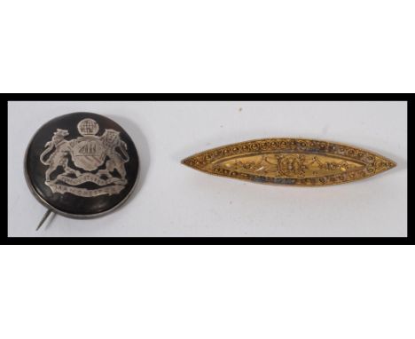 A vintage 20th century Edwardian gold metal bar brooch together with a silver hallmarked silver and tortoiseshell brooch inla