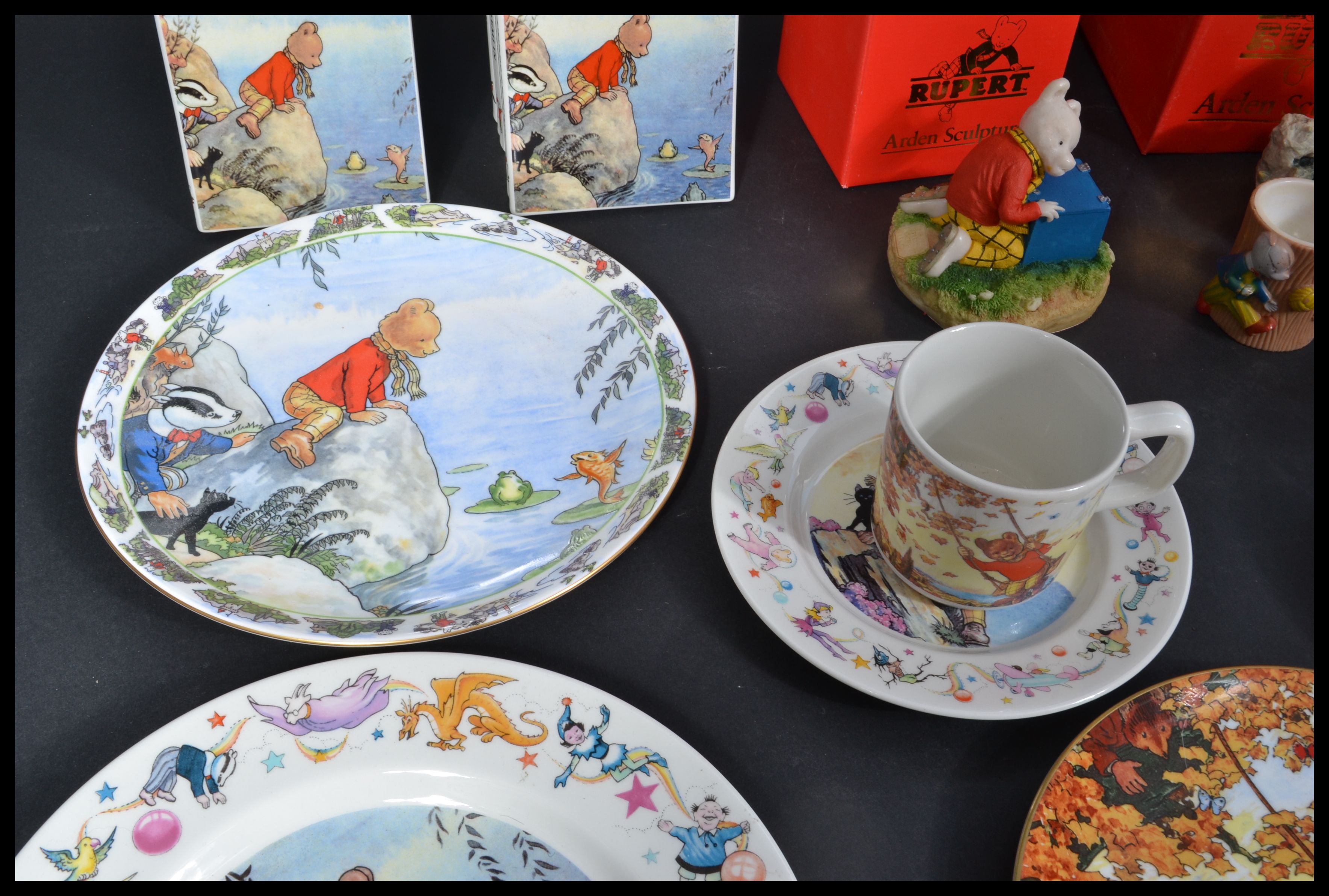 A collection of Rupert The Bear related items to include three boxes