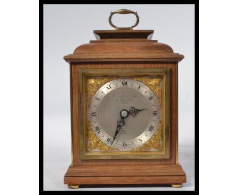 A mid century Elliott&nbsp; Garrard &amp; Co of London bracket - mantel clock having silvered and brass dial set within a mah