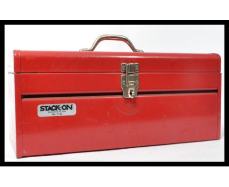 A vintage 20th century red vitreous enamel toolbox containing a group of vintage tools. Tools to include levels , saws , dril