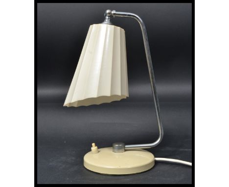 A 1940's art deco vintage Bauhaus style desk lamp having a cream terraced base on a polished steel arm and a cream plastic sh