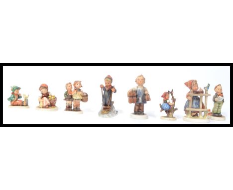 A collection of eight 20th Century ceramic figures of children in various poses by Hummel all stamped to the base. Highest me
