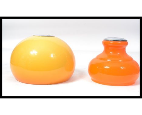 Two vintage 20th century retro lamp shades / ceiling lights one being a tapered orange glass example and the other a yellow p