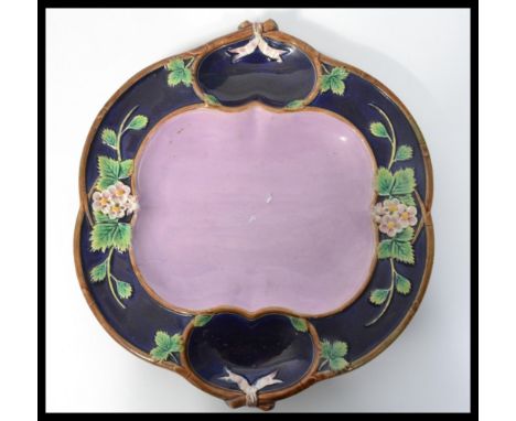 A 19th century Majolica&nbsp;Hors d'oeuvre dish in blue and pink with&nbsp; floral sprays. The back unmarked but for Victoria