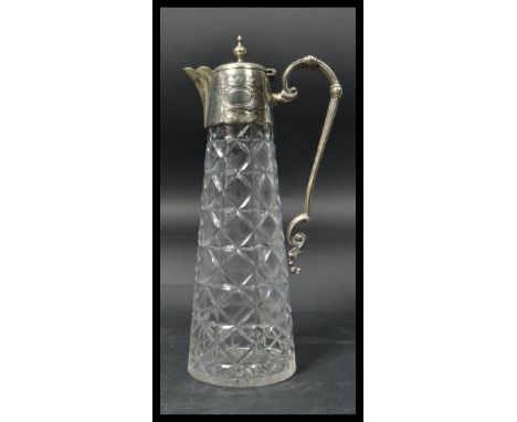 A vintage 20th century silver plated and cut glass claret jug. The cut glass body having silver plated collar mounts and lid.
