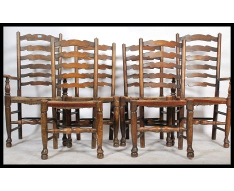 A set of 6 20th century country oak ladderback dining chairs. Raised on turned legs united by peripheral stretchers having ra