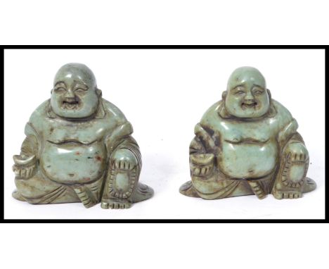 A pair of early 20th century carved soapstone Chinese laughing Buddha 's holding pots. Jade green colouring with good details