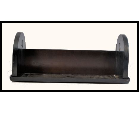 An early 20th Century Art Deco collapsible bakelite book trough / tidy. Makers mark for EBCO in original black finish. Measur
