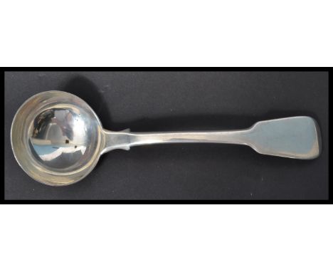 A hallmarked silver 19th century Georgian ladle in the fiddle pattern by Jonathan Hayne  . Hallmarked for London 1821. Weighs