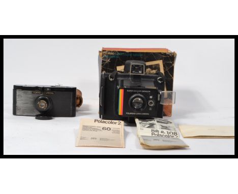A vintage / retro Polaroid super colour swinger land camera in it's original box together with a Purma Special camera in case