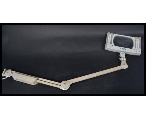 A Luxo adjustable illuminated magnifying&nbsp; desk - clamped medical / watch makers work lamp