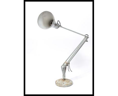 A vintage 20th century retro industrial anglepoise desk lamp raised on a circular base with pendant shade. Anglepoise Trade M