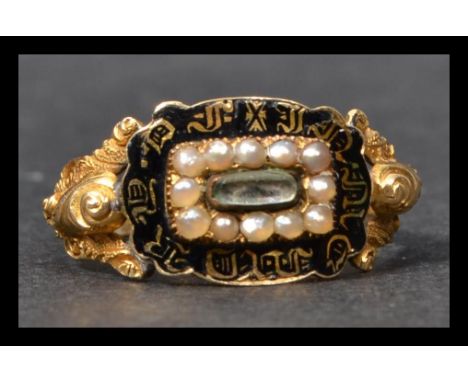 A hallmarked 18ct gold Georgian black enamel and pearl mourning ring. The ring having a rectangular top with a central glazed