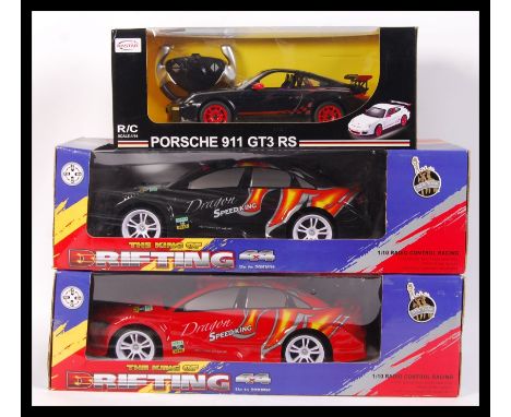 Three various branded RC Radio Controlled cars to include; Rastar 1:14 scale Porsche 911 GT3 RS &amp; 2x New York Gift Co. 1: