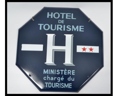 A French 20th century enamel painted metal advertising sign with blue ground and details for Hotel De Tourisme - Ministere ch
