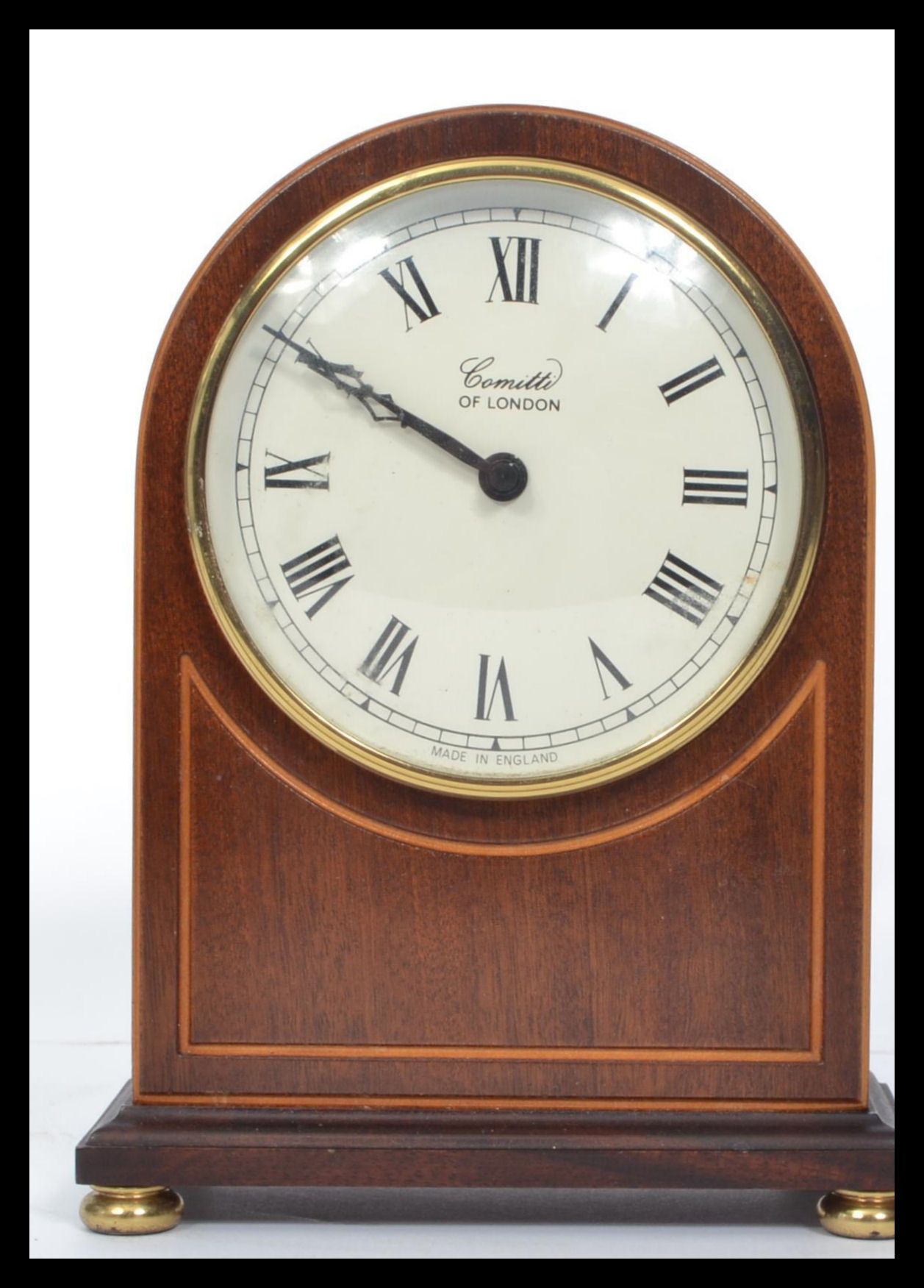 A good quality mahogany inlaid Comitti of London dome top mantel clock