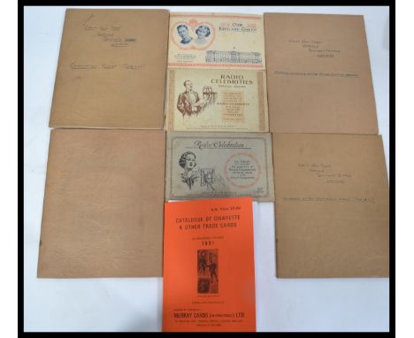 A collection of early 20th century cigarette cards in albums to include Players Uniforms of the Terrirtorial Army, Coronation